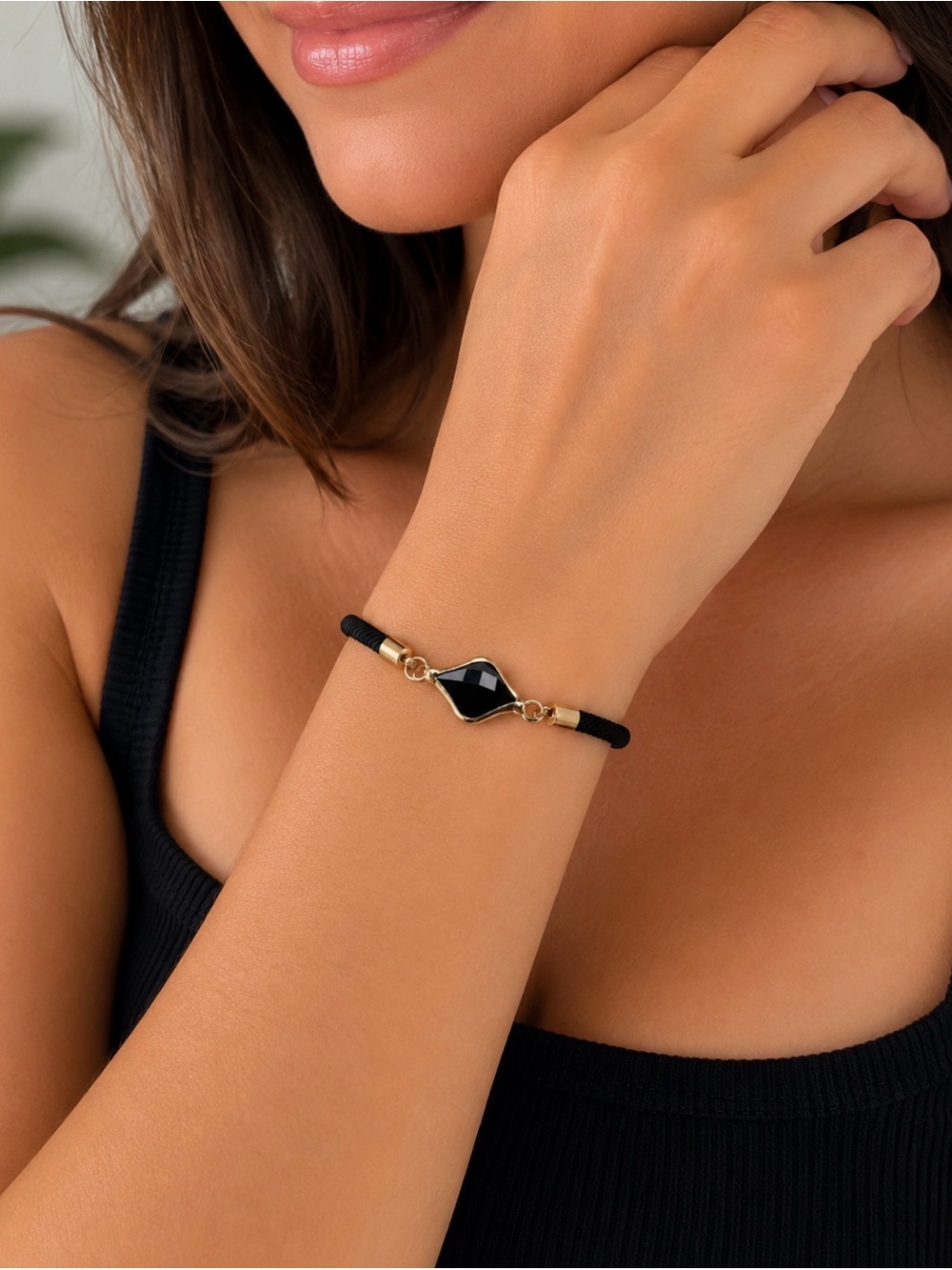 Black Milan cord bracelet featuring a central diamond-shaped (kite-cut)